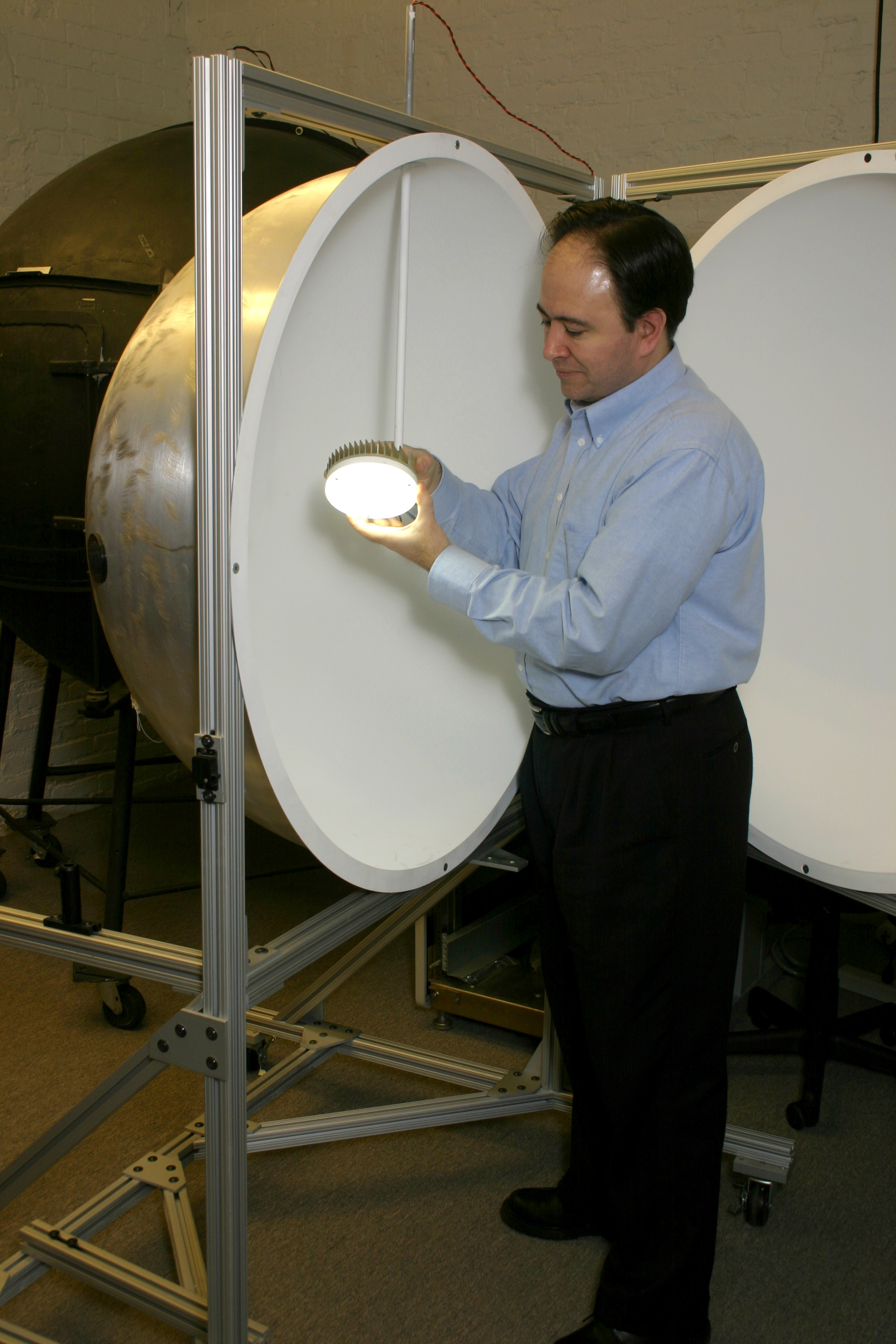 LRC researcher with luminaire and integrating sphere