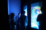 Students examine exhibits at the Light Fair