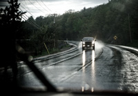 photo: headlights on during daytime rain