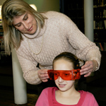 Dr. Figueiro demonstrates the Daysimeter with a middle school student